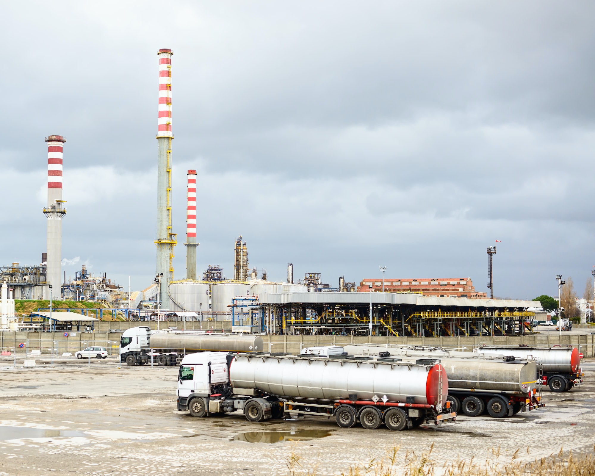 oil refinery industry smoke stacks and tanker lorry or truck.jpg